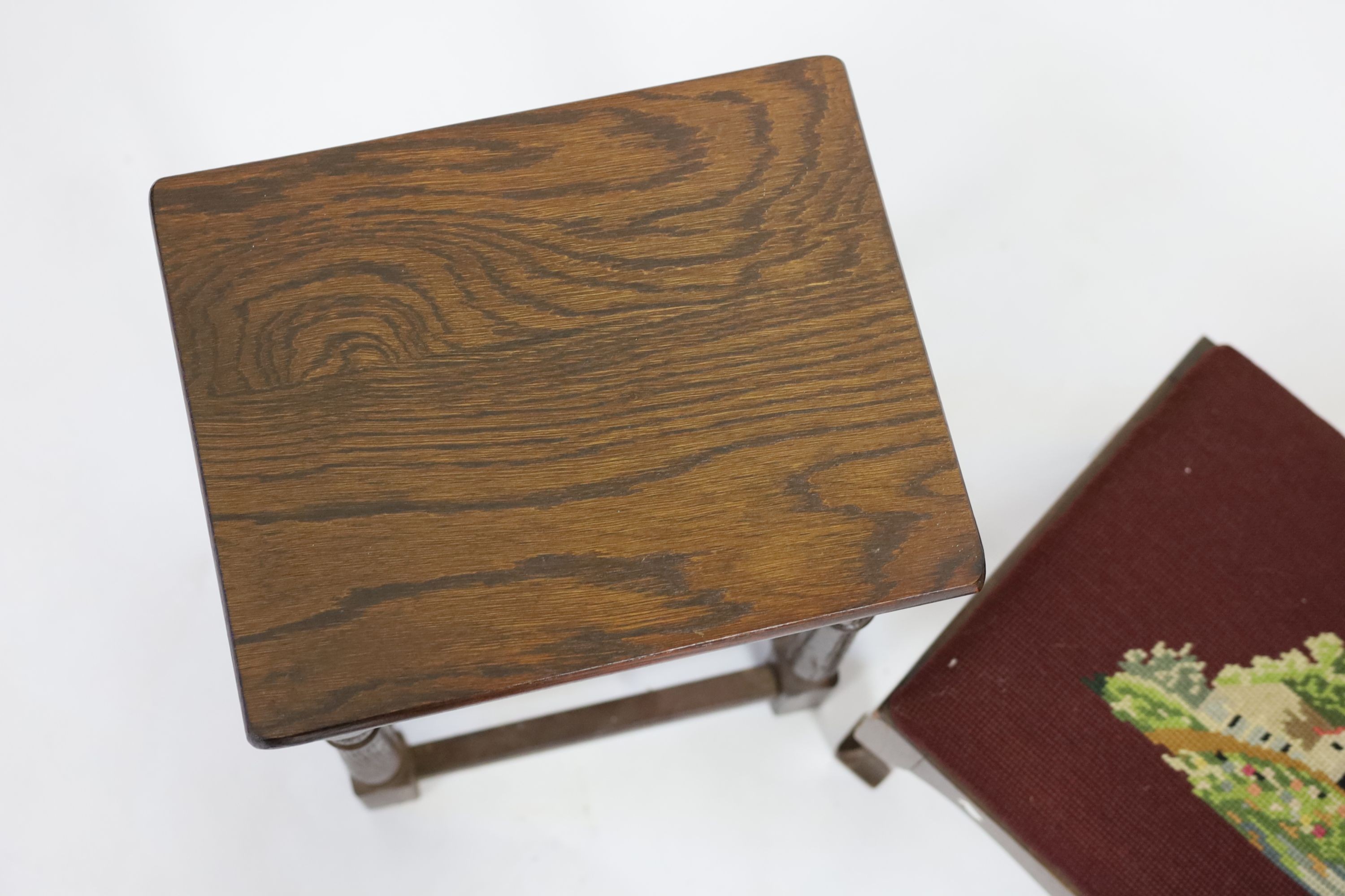 An 18th century style rectangular oak stool, height 41cm, together with a tapestry foot stool